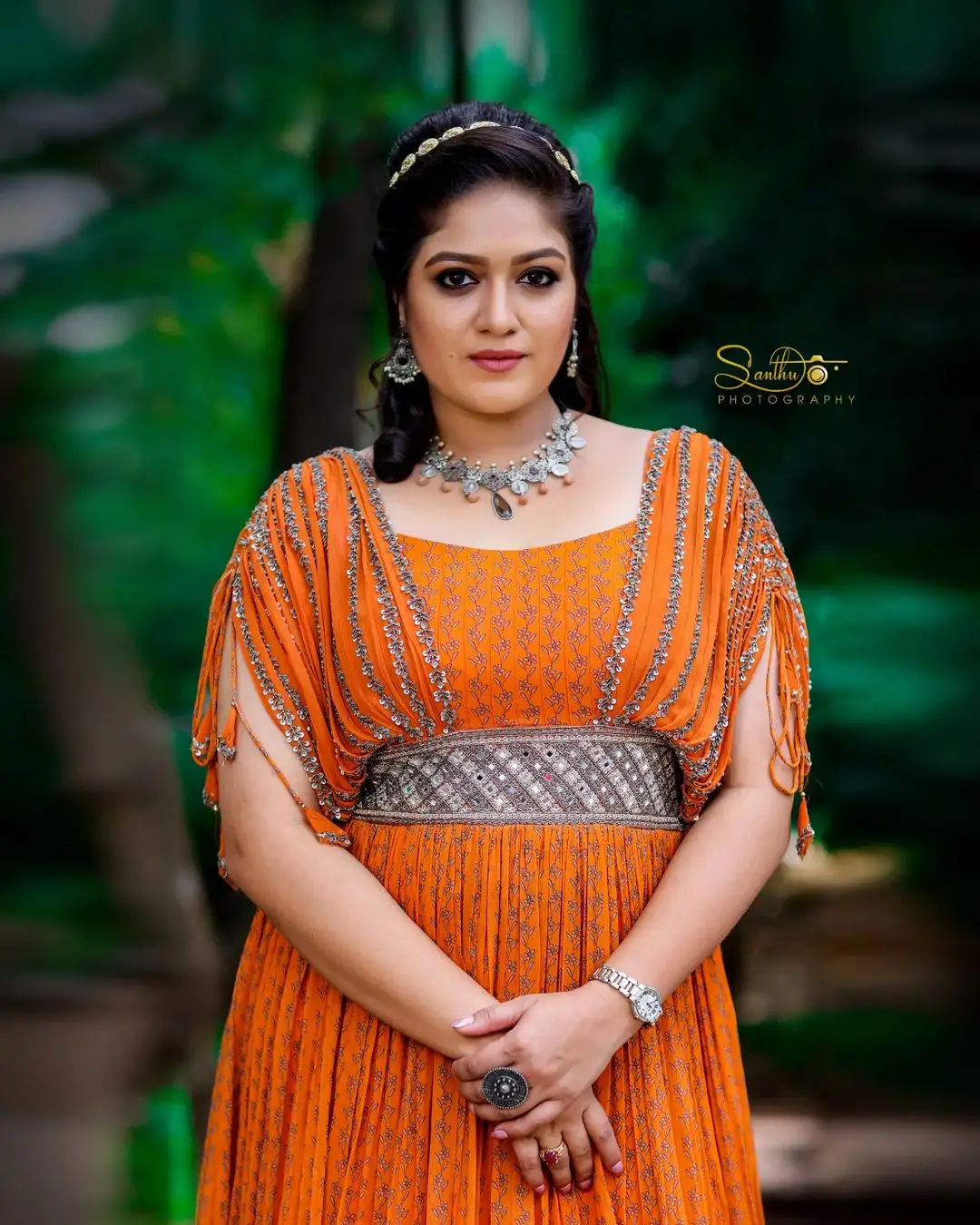 Meghana Raj Wearing Beautiful Earring Jewellery Orange Gown